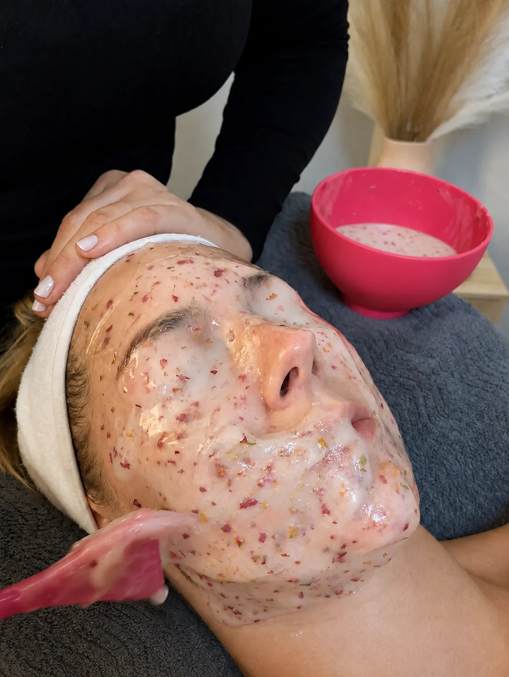An Esthemax enzyme mask being applied during a facial at Pause by Mel